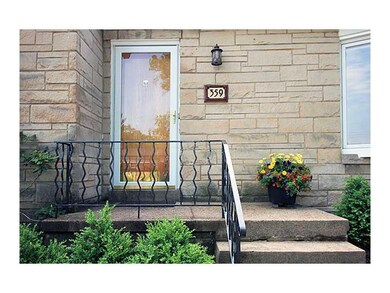 Exterior Front. The driveway walls and front lands