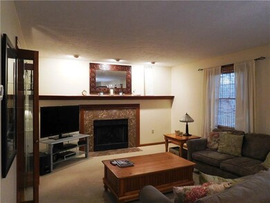 family room with gas fireplace adjacent to eat in 