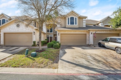 View of front of property featuring driveway, sto
