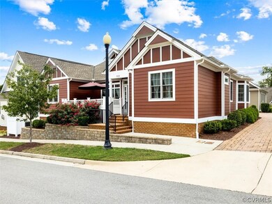 FRONT AND SIDE ELEVATION ALONG WITH DRIVEWAY VIEW.  SIDEWALKS THROUGHOUT THIS NEIGHBORHOOD ALLOWS FOR SAFE WALKING SPACE.