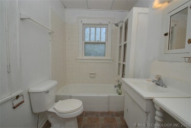 One of two full bathrooms, this hall bath has a va