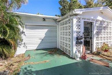 Long Driveway in front of house with garage