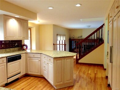 Unique White Oak Cabinetry with Paneled Appliances