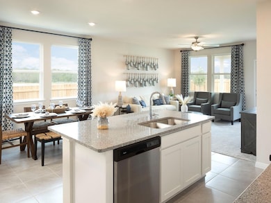 Kitchen with stainless steel dishwasher, a sink, 