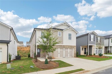 Craftsman-style home with an attached garage, conc