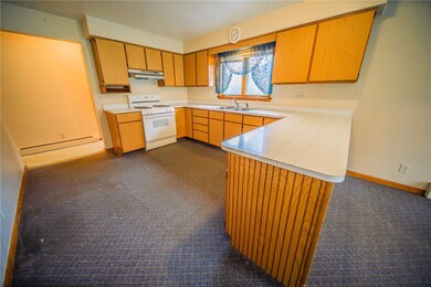 Kitchen is open to the dining area with counter to