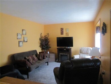 The living room has hardwood under the WW carpet. 