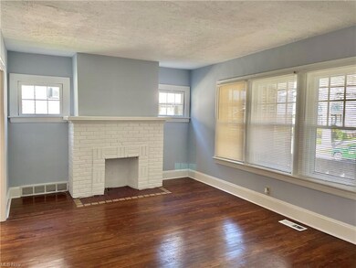 This first floor unit is freshly painted in today's colors. Hardwood floors have been refinished. Fireplace adds charm to this Lakewood home.