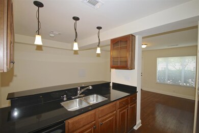 Notice the decorative cabinets and the pendent lig