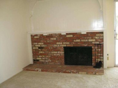 Fireplace in living room with custom mantle
