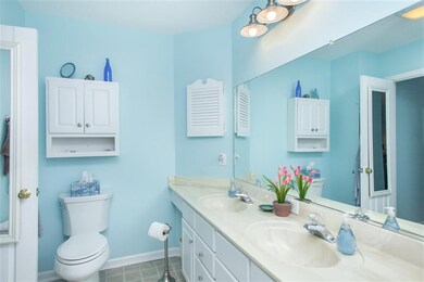 Master bathroom includes dual sinks.