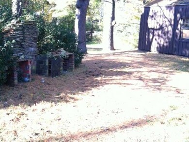 Yard/Garden. large yard with stone pit