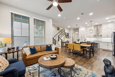 Living room with light wood finished floors, visib