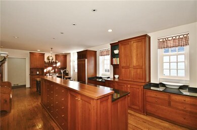 Gourmet kitchen features custom cherry cabinetry, 