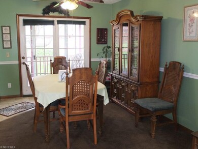 Dining room has chair rail and access to back cove