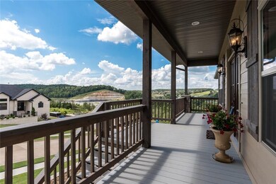 Large covered front porch with rolling hill views.