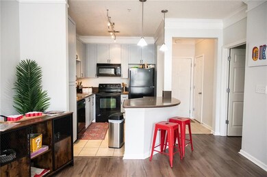 Kitchen with rail lighting, a kitchen breakfast ba