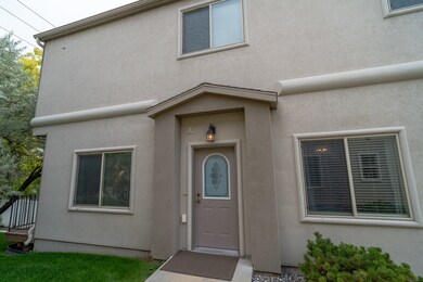 View of exterior entry featuring stucco siding