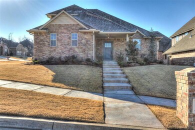 View of front facade featuring brick siding, roof 