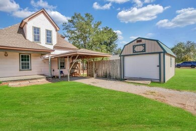 Garage featuring a yard