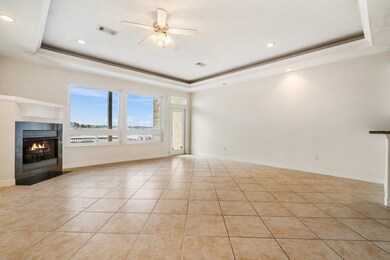Spacious living area with picture windows looking
