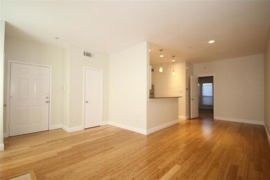 Open living area with bamboo flooring.