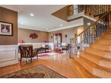 Dramatic Foyer featuring turned staircase, arched 