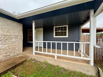 Doorway to property featuring stone siding and co