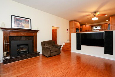 ** Cozy Fireplace in Family Room **