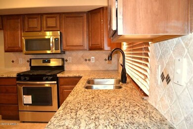 Granite and Tumble Travertine Backsplash