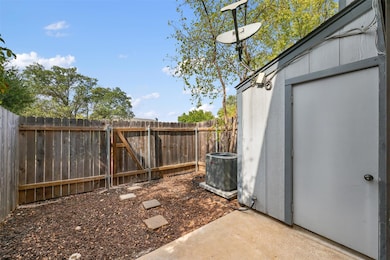 Fenced backyard featuring a gate