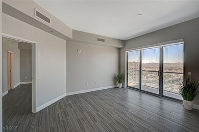 Unfurnished room with dark wood-style flooring, vi