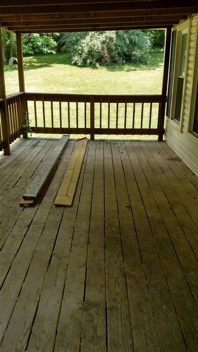 This Enormous Front Porch is just Waiting for a Sw