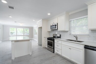 Kitchen features a grand kitchen island as its anc
