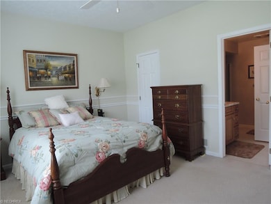 Spacious master bedroom with a walk in closet and 