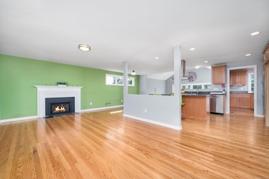 From the front door, greeted with open concept living room and kitchen