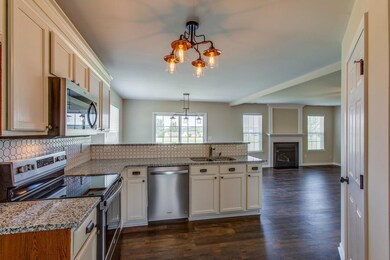Lovely new kitchen with a chic tile backsplash.