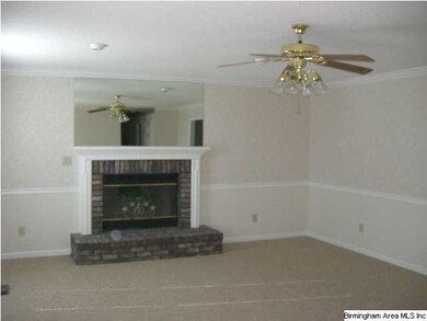 Living room has a nice fireplace for all those col
