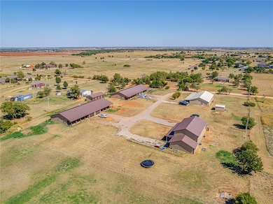 Birds eye view of property with a rural view