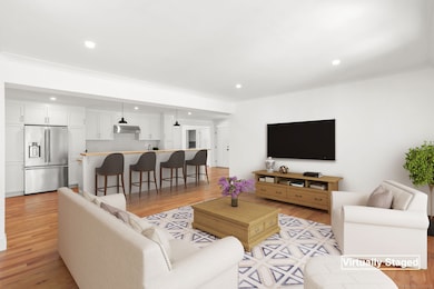 Option 2: Virtually staged, kitchen overlooking family room area.