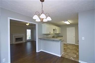 View from dining area into living area with kitche