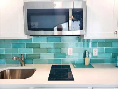 Details with decorative backsplash, white cabinetr