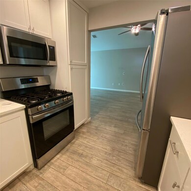 Kitchen featuring appliances with stainless steel