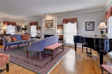 The large family/living room has great space with a gas fireplace and extensive trim.