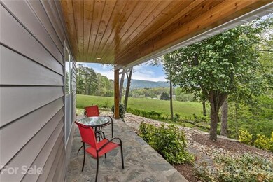 Covered front porch with long range views