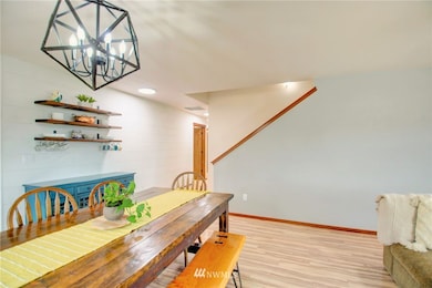 The open concept family area. The dining space sits between the living room and the kitchen.