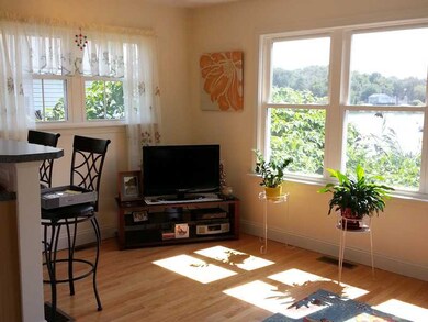Living Room. Sunny and bright with striking water