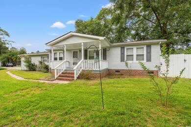 Bungalow-style home featuring a front lawn and cov