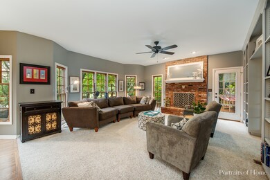 Kitchen opens to lovely Family Room w/brick firepl