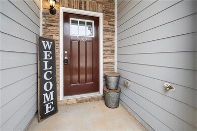 View of exterior entry with stone siding